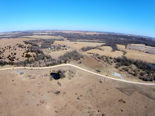 Aerial fields, road and pond at Cowboy Meadows, Chautauqua County, Kansas